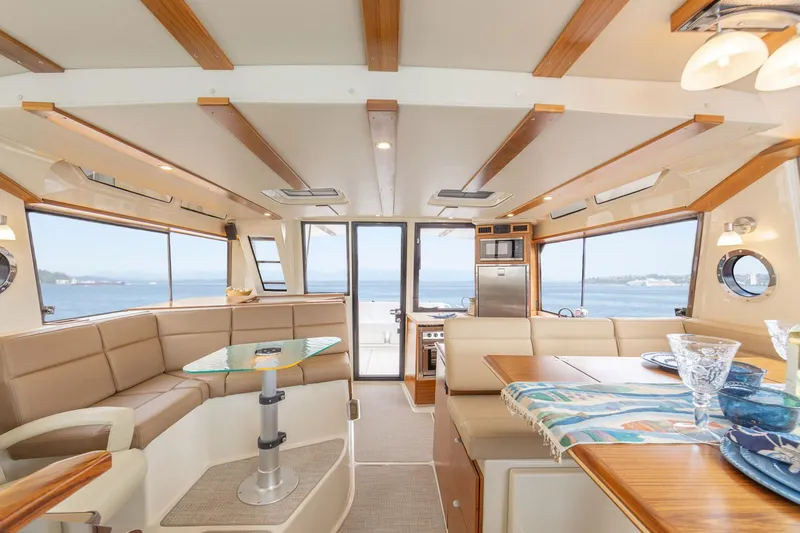 Slide: The Image of Luxurious interior of 2025 Ranger Tugs R-43 S yacht with ocean view. - 11