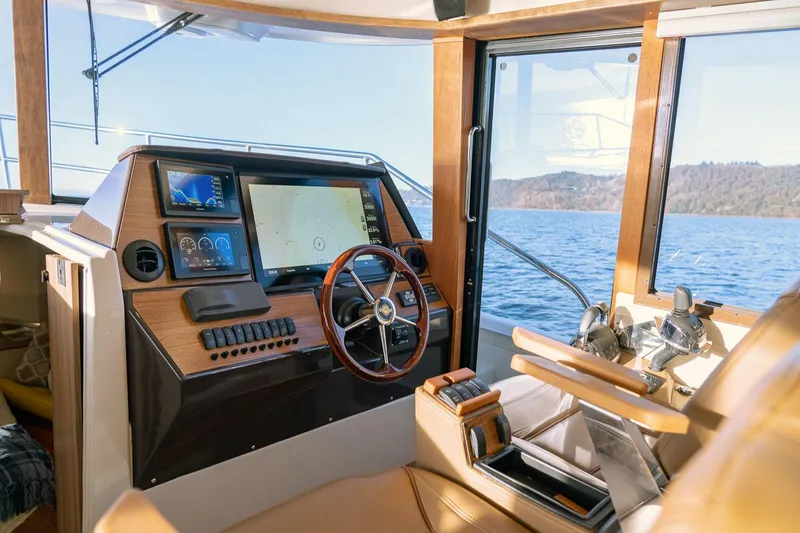 Slide: The Image of Interior helm of 2025 Ranger Tugs R-43 S with modern navigation equipment. - 18