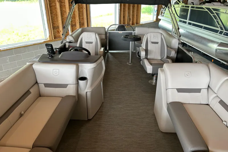 Slide: The Image of 2023 Godfrey SWEETWATER 2286 SB pontoon boat interior with plush seating and helm. - 6