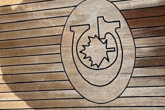 Slide: The Image of Wooden deck with engraved emblem on a 2016 Gozzard 41 RC sailboat. - 14