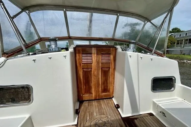Slide: The Image of Cockpit of 2016 Gozzard 41 RC sailboat with wooden doors and teak flooring. - 15