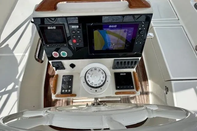Slide: The Image of Helm of 2016 Gozzard 41 RC with navigation instruments and compass. - 16