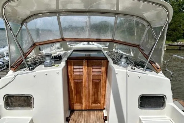 Slide: The Image of 2016 Gozzard 41 RC yacht cockpit with wooden doors and protective canopy. - 18