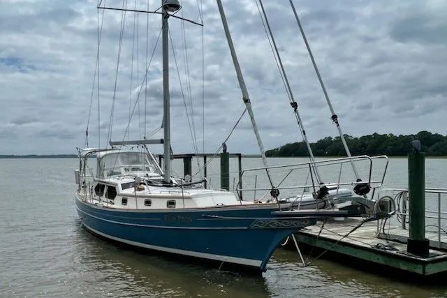 Slide: The Image of Sailboat Gozzard 41 RC, 2016 model, docked on a cloudy day. - 2