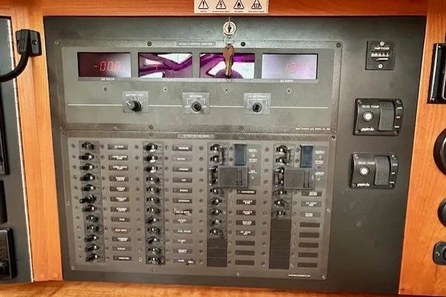 Slide: The Image of Electrical control panel of a 2016 Gozzard 41 RC yacht with switches and meters. - 23
