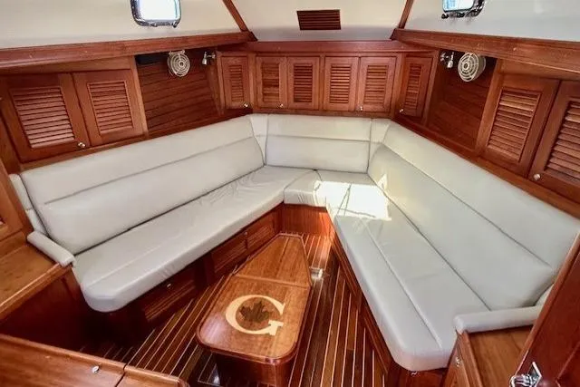 Slide: The Image of Luxurious interior of 2016 Gozzard 41 RC yacht with elegant wood finish and plush seating. - 26
