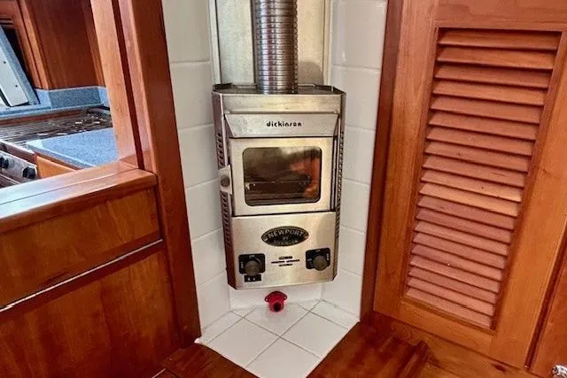 Slide: The Image of Stainless steel stove in 2016 Gozzard 41 RC yacht interior, featuring wooden cabinetry. - 27