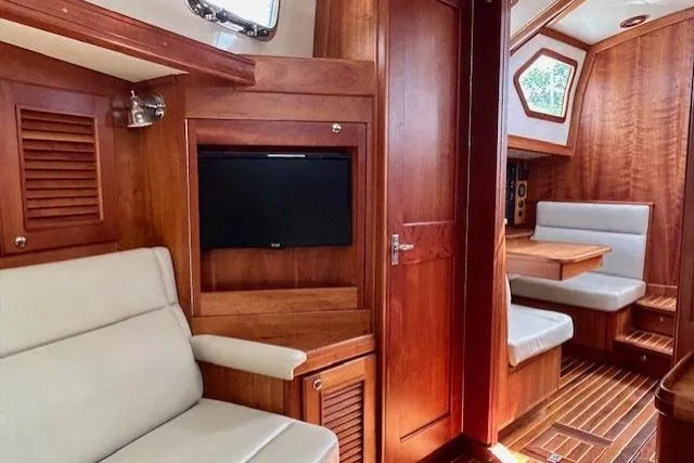 Slide: The Image of Luxurious interior of 2016 Gozzard 41 RC yacht with wood finish and seating area. - 29