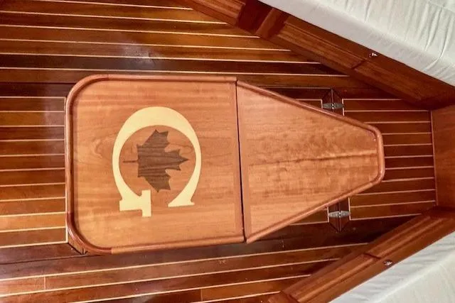 Slide: The Image of Wooden interior of 2016 Gozzard 41 RC sailboat with maple leaf inlay design. - 30
