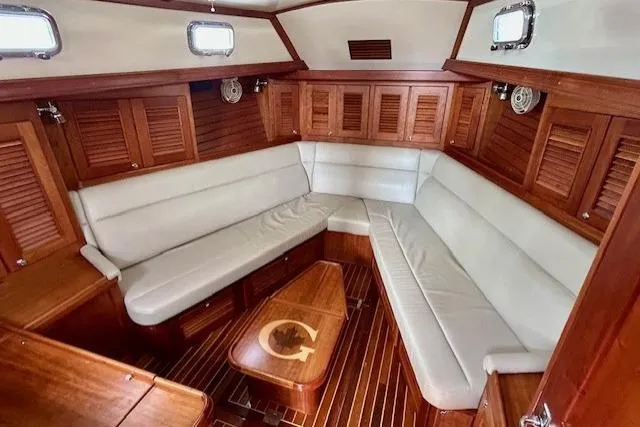 Slide: The Image of Luxurious interior of 2016 Gozzard 41 RC yacht with elegant wood finish and plush seating. - 31