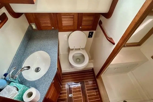 Slide: The Image of Luxurious 2016 Gozzard 41 RC yacht bathroom with wooden accents and modern fixtures. - 33