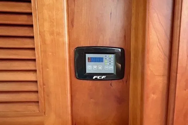 Slide: The Image of Control panel on 2016 Gozzard 41 RC yacht, mounted on wooden interior. - 37