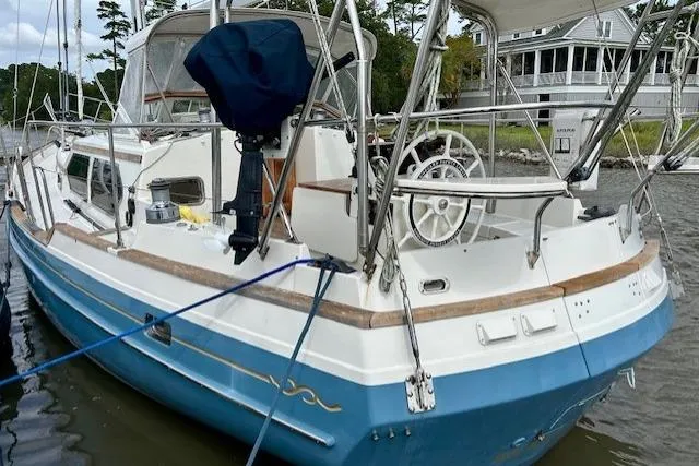 Slide: The Image of 2016 Gozzard 41 RC sailboat docked, featuring blue hull and white deck. - 41