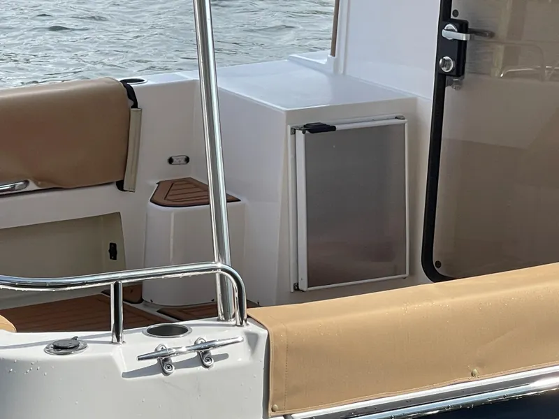 Slide: The Image of 2025 Ranger Tugs R-31S boat interior with seating and storage. - 13