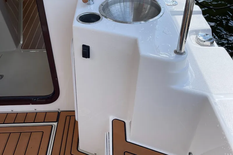Slide: The Image of Ranger Tugs R-31S 2025 boat interior with sink and wooden flooring. - 19