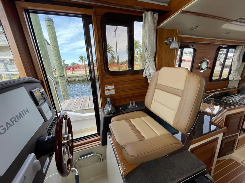 Slide: The Image of Interior helm of 2025 Ranger Tugs R-31S with Garmin navigation system. - 24