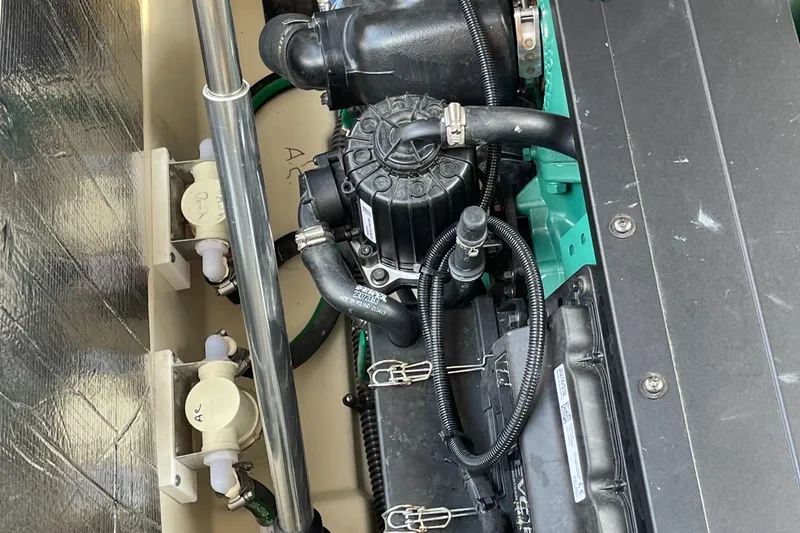 Slide: The Image of Engine compartment of 2025 Ranger Tugs R-31S boat showing detailed components. - 38