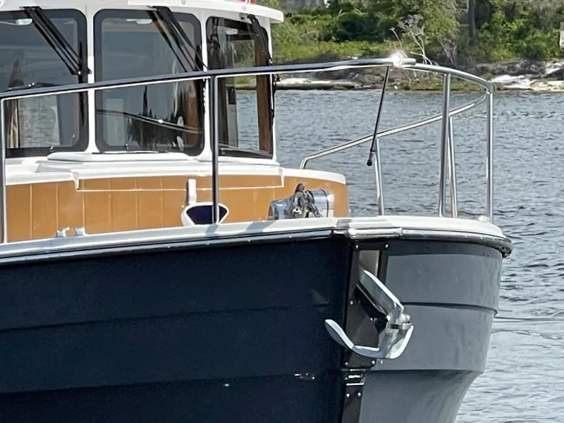 Slide: The Image of 2025 Ranger Tugs R-31S boat bow on water. - 5