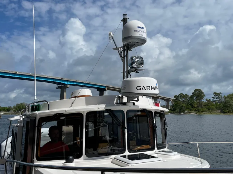 Slide: The Image of 2025 Ranger Tugs R-31S boat with Garmin radar on a scenic waterway. - 7