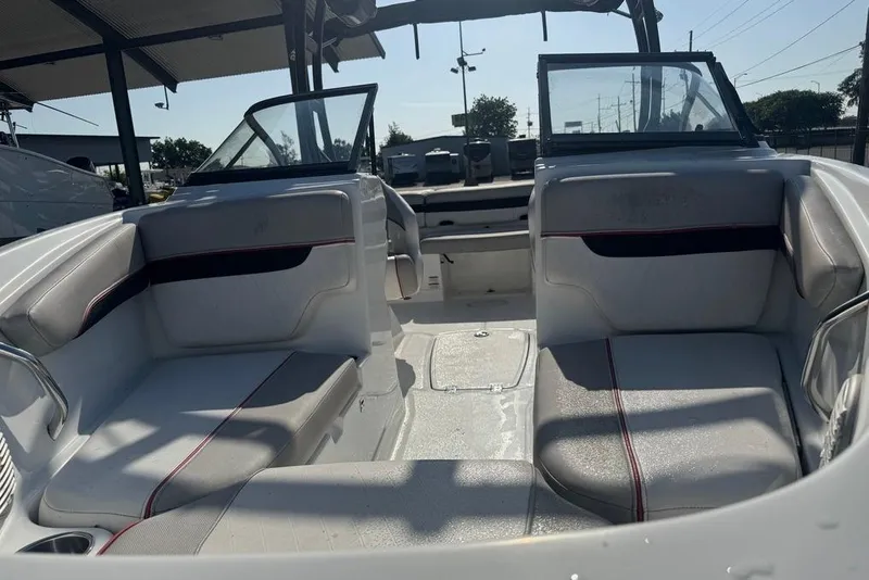 Slide: The Image of 2018 Tahoe 700 TF boat interior with seating and open deck under a canopy. - 14
