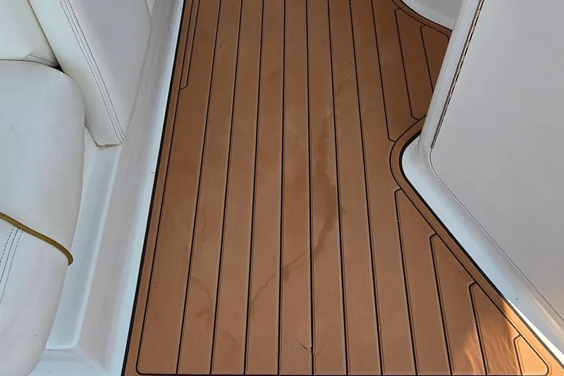 Slide: The Image of Teak deck and white seating on 2003 Sea Ray 280 Sundancer boat. - 18