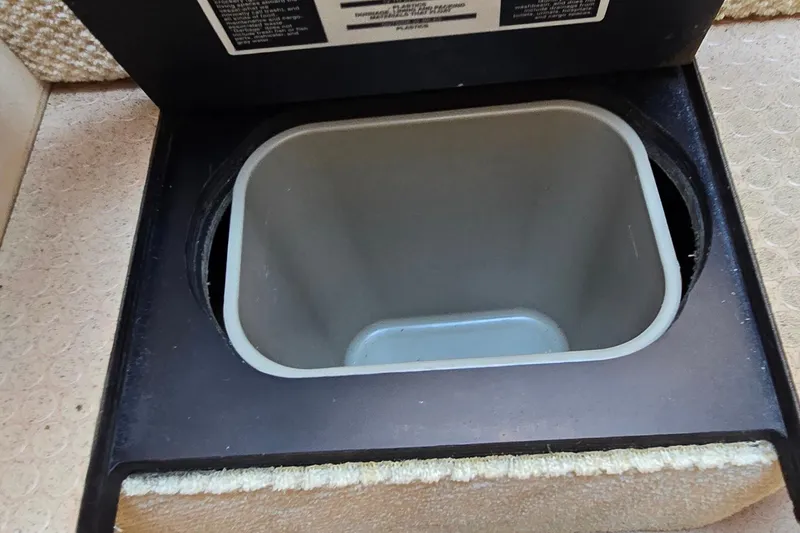 Slide: The Image of Storage compartment on a 2003 Sea Ray 280 Sundancer boat. - 27