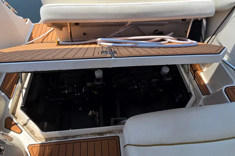 Slide: The Image of Open engine compartment of 2003 Sea Ray 280 Sundancer boat with teak deck. - 39