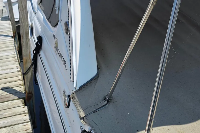 Slide: The Image of 2003 Sea Ray 280 Sundancer docked, showcasing sleek design and sturdy construction. - 4