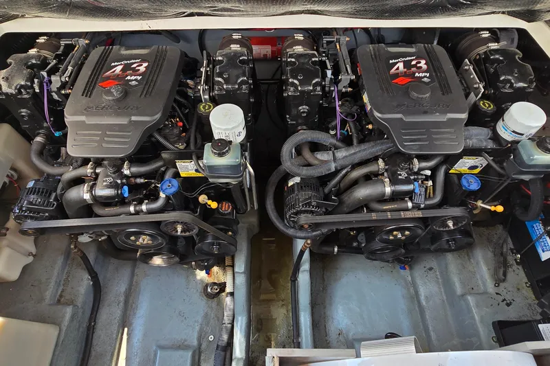 Slide: The Image of Engine compartment of a 2003 Sea Ray 280 Sundancer with twin MerCruiser 4.3 MPI engines. - 41