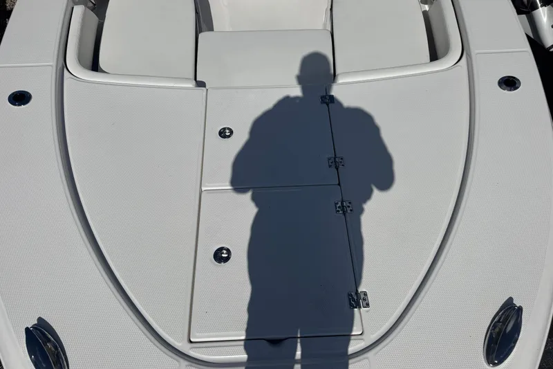 Slide: The Image of Shadow on the deck of a 2025 Robalo 246 Cayman SD boat. - 12