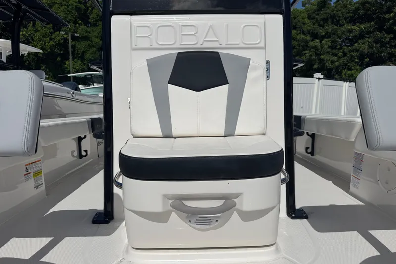 Slide: The Image of 2025 Robalo 246 Cayman SD boat seat with sleek black and white design. - 17