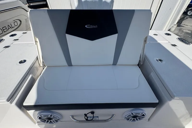 Slide: The Image of 2025 Robalo 246 Cayman SD boat seating with integrated speakers and sleek design. - 19
