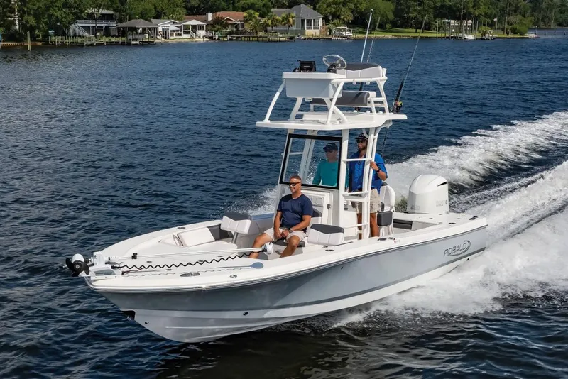 Slide: The Image of Manufacturer Provided Image: 2025 Robalo 246 Cayman SD boat cruising on a scenic lake. - 26