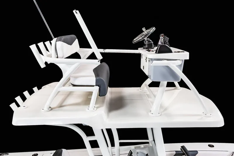 Slide: The Image of Manufacturer Provided Image: 2025 Robalo 246 Cayman SD boat helm and seating area, featuring sleek design and modern controls. - 32