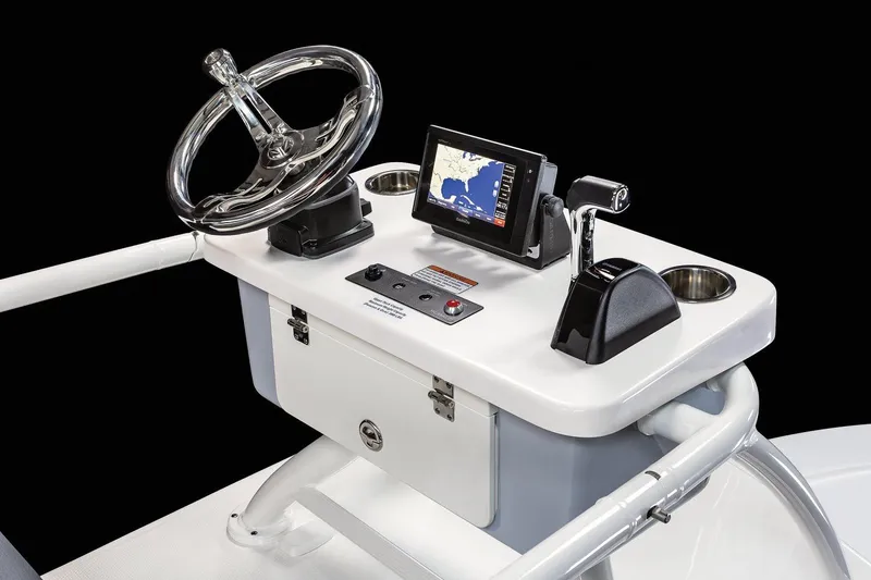 Slide: The Image of Manufacturer Provided Image: 2025 Robalo 246 Cayman SD boat console with steering wheel and navigation display. - 33