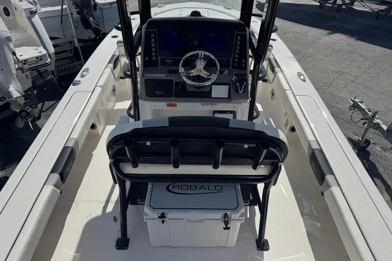 Slide: The Image of 2025 Robalo 246 Cayman SD boat interior with steering console and seating. - 4