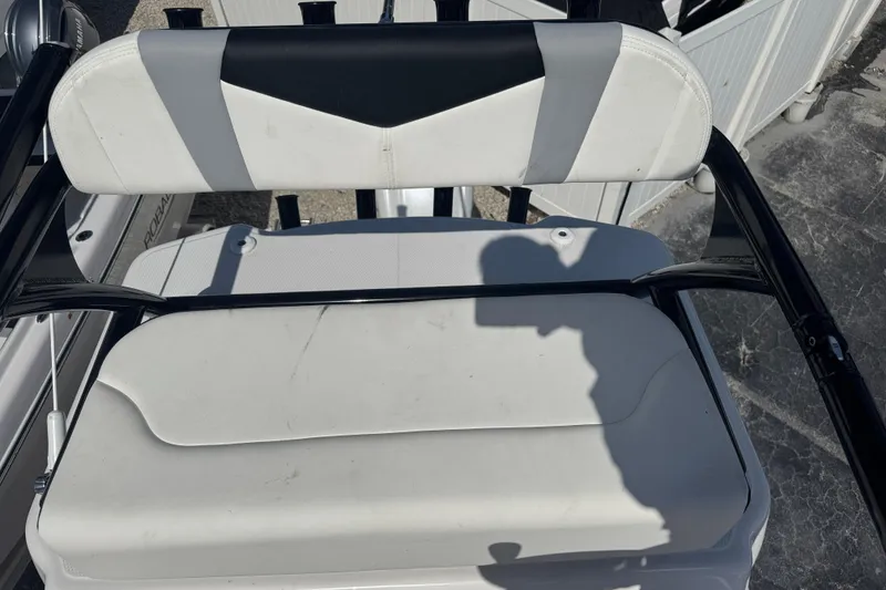 Slide: The Image of 2025 Robalo 246 Cayman SD boat seat with black and white upholstery. - 49