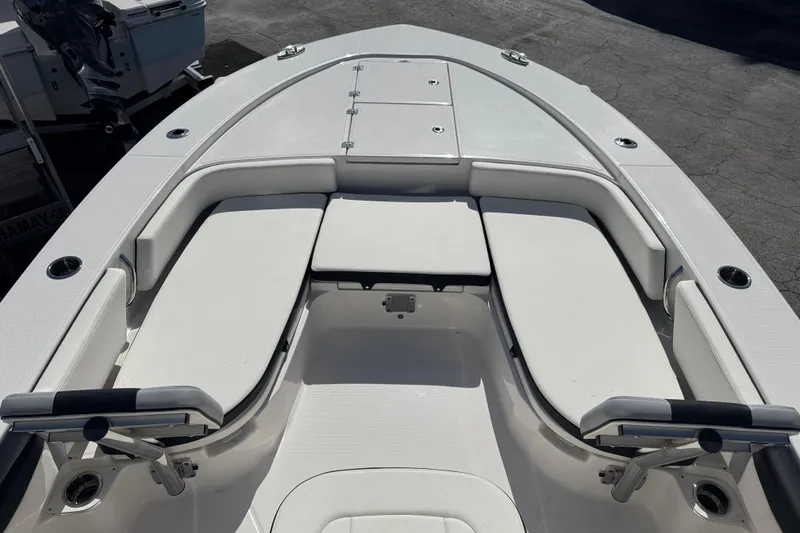 Slide: The Image of 2025 Robalo 246 Cayman SD boat with spacious seating and sleek design. - 9