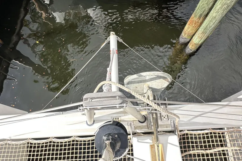 Slide: The Image of Top view of 2022 Lagoon 40 catamaran bow with anchor and ropes. - 10