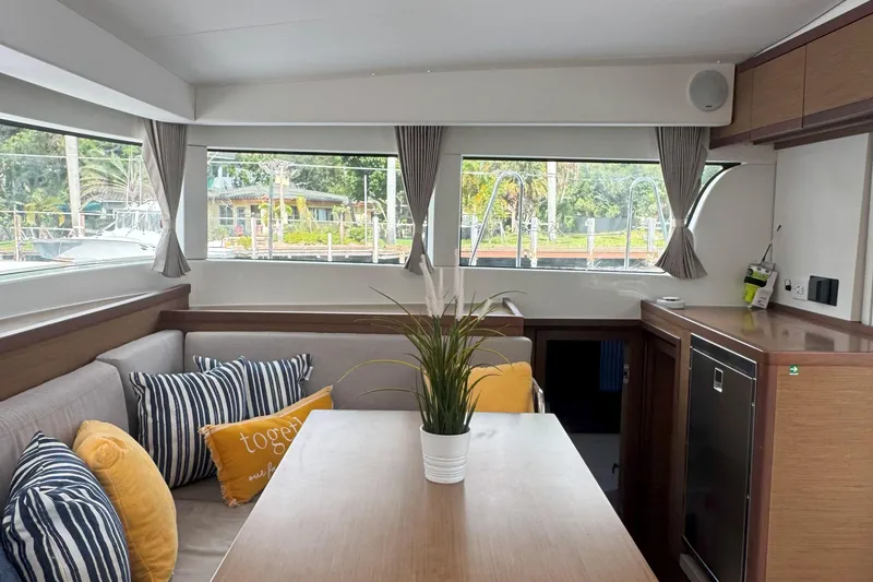 Slide: The Image of Interior of 2022 Lagoon 40 catamaran with cozy seating and modern decor. - 25