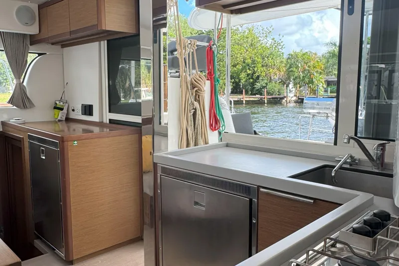 Slide: The Image of Modern kitchen interior of 2022 Lagoon 40 catamaran with outdoor view. - 28
