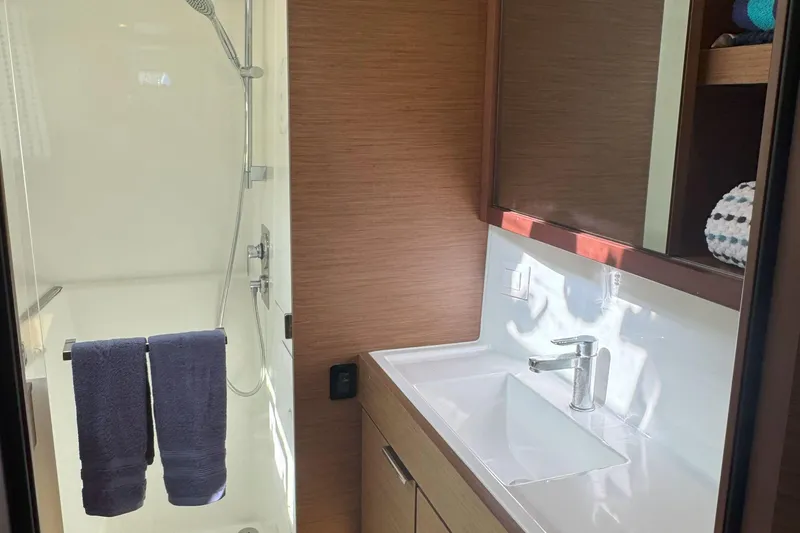Slide: The Image of Modern bathroom in 2022 Lagoon 40 yacht with shower and sleek vanity. - 42