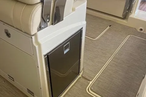 Slide: The Image of 2026 Chris-Craft Catalina 31 interior with beige seating and built-in storage. - 14