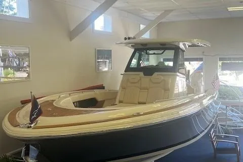 Slide: The Image of 2026 Chris-Craft Catalina 31 boat displayed indoors, showcasing sleek design and luxury features. - 3