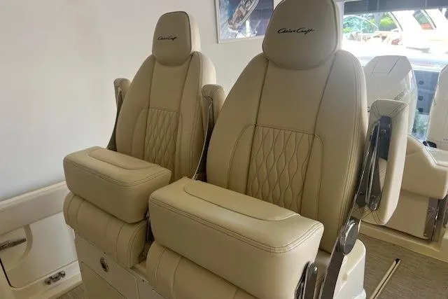 Slide: The Image of Luxurious beige seats in 2026 Chris-Craft Catalina 31 boat, featuring elegant stitching and armrests. - 5