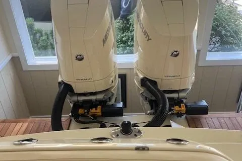 Slide: The Image of 2026 Chris-Craft Catalina 31 with dual Mercury outboard engines in a showroom. - 7