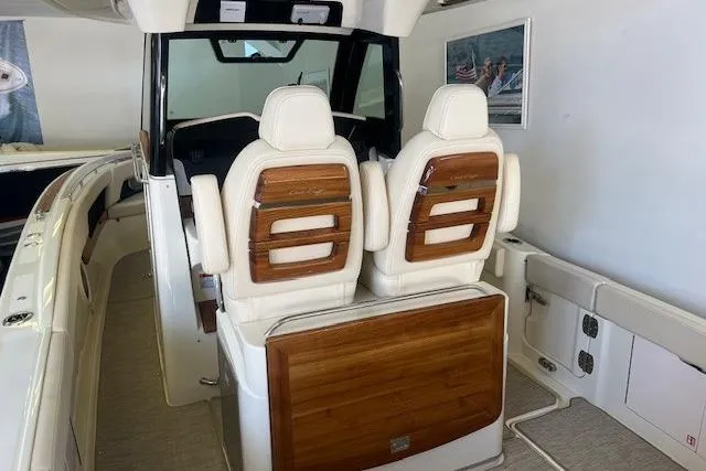 Slide: The Image of 2026 Chris-Craft Catalina 31 boat interior with elegant seating and wood accents. - 8