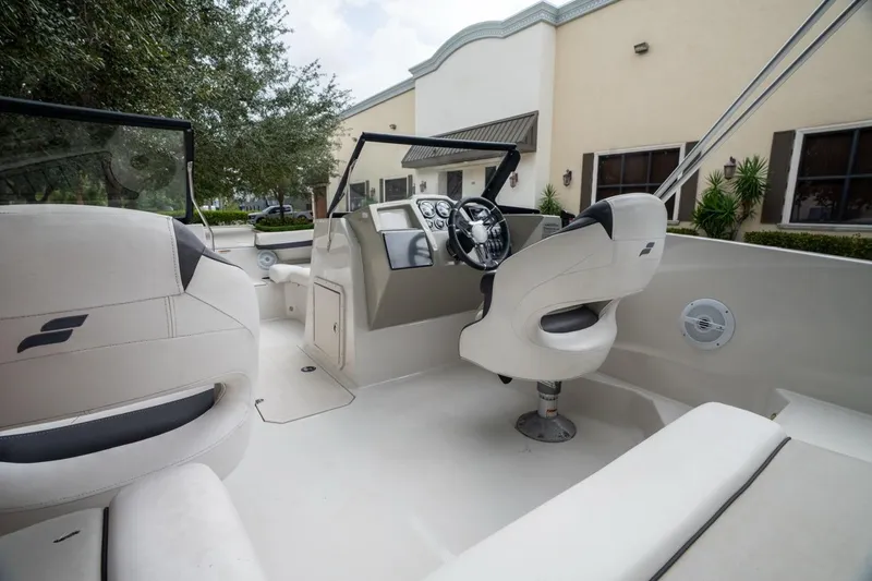 Slide: The Image of 2022 Starcraft SVX 190 DC boat interior with modern seating and steering wheel. - 10