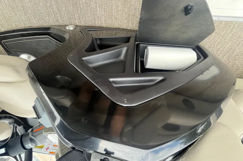 Slide: The Image of 2020 Premier 230 SunSation RF boat console with storage compartment and paper towel holder. - 39