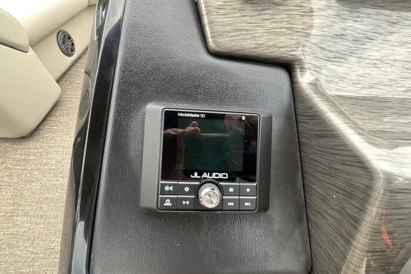 Slide: The Image of JL Audio MediaMaster 50 control panel on 2020 Premier 230 SunSation RF boat dashboard. - 43